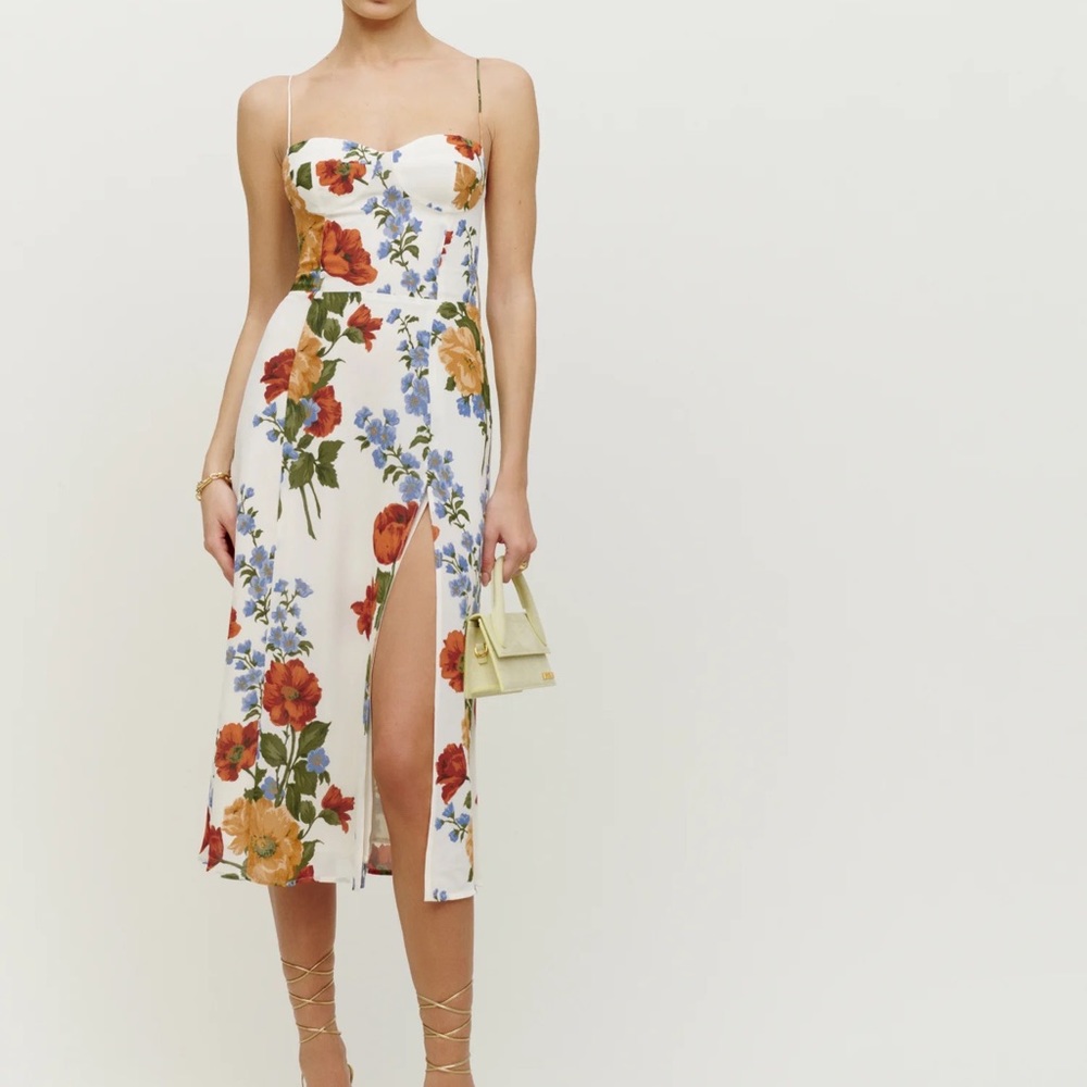 The Juliette is slim fitting throughout with a slit and adjustable straps.